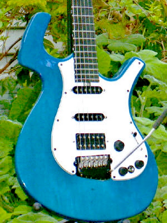 Fully carved from a single piece of very dense Swamp Ash